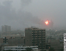 An explosion is seen in Baghdad early Thursday.