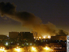 Smoke rises over Baghdad early Monday after a night of heavy bombing raids.